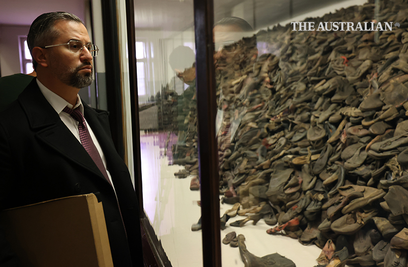 Eitan in Auschwitz looking at children's shoes