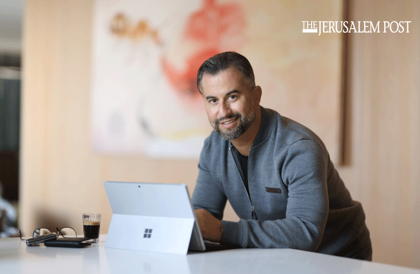 Eitan Neishlos in apartment with ipad in tel aviv